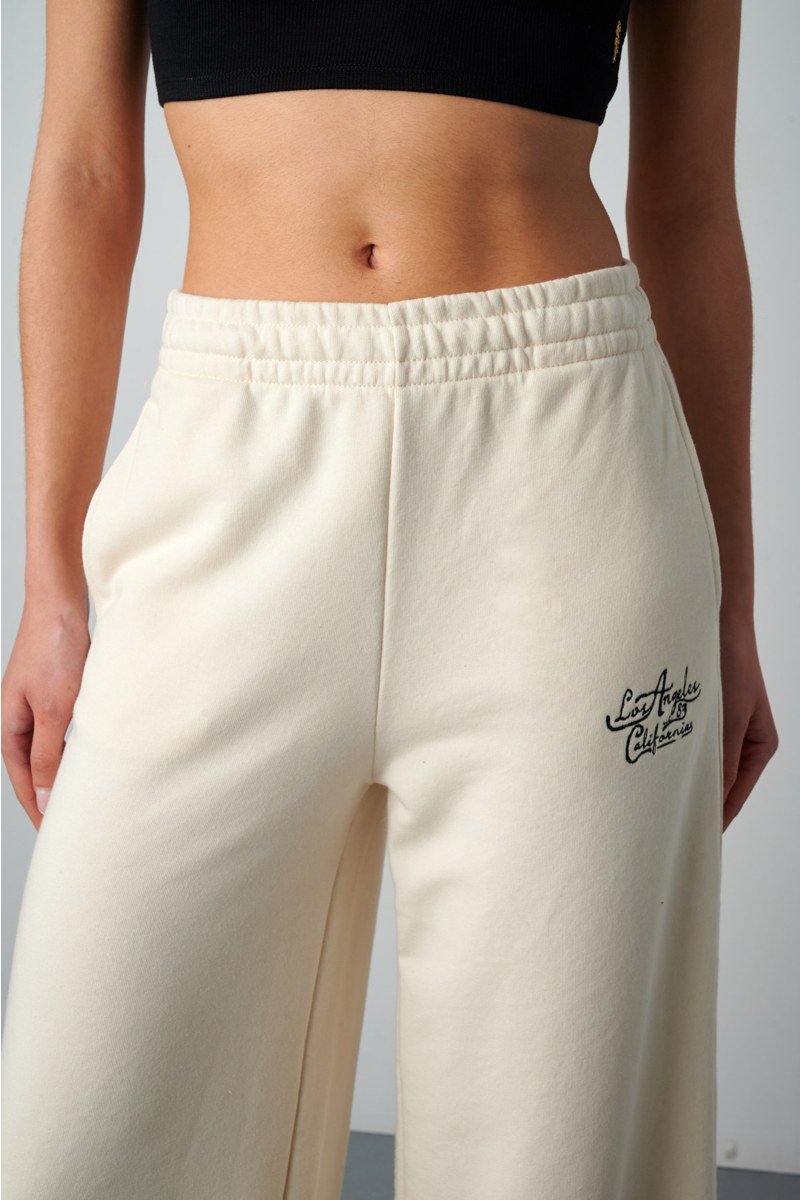 HIGH WAISTED FLARED COTTON PANTS WITH BLACK EMBROIDERED DETAIL-25811023-103